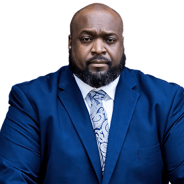 A man with a beard is wearing a blue suit and tie and he's also a business man.