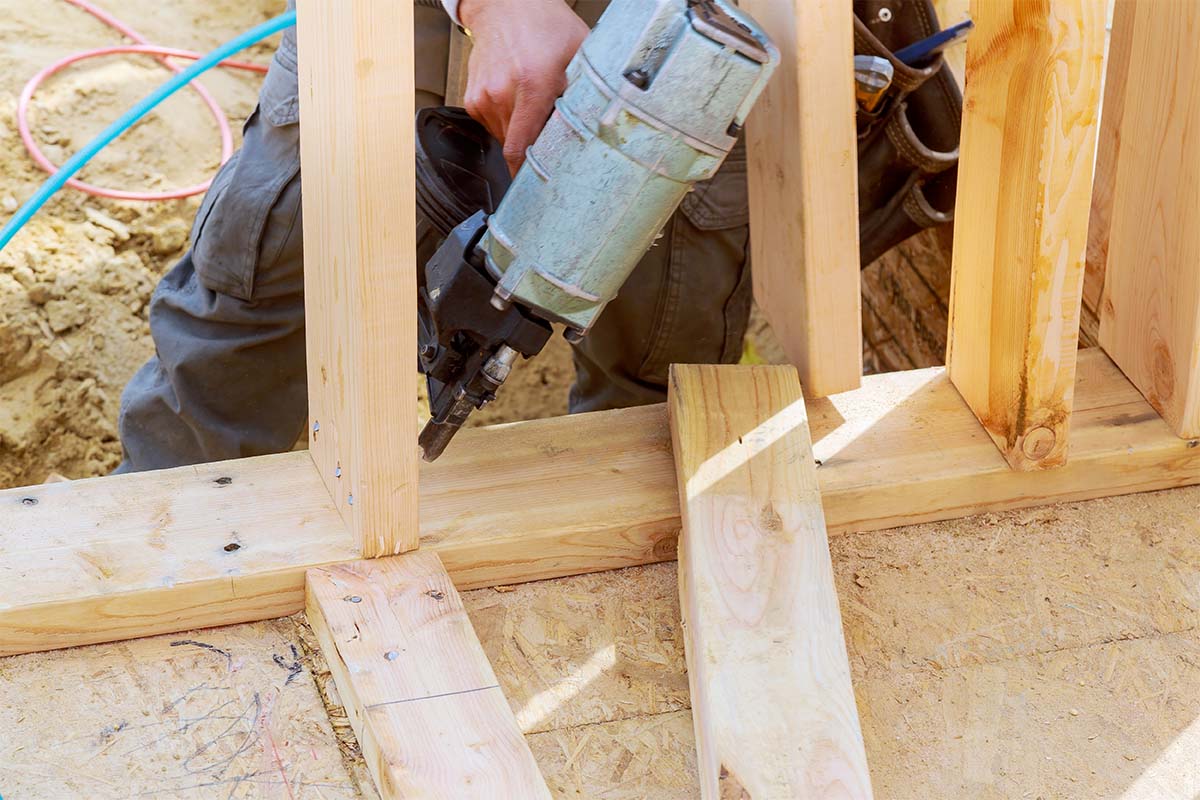 Carpenter Installing Timber Wall Studs