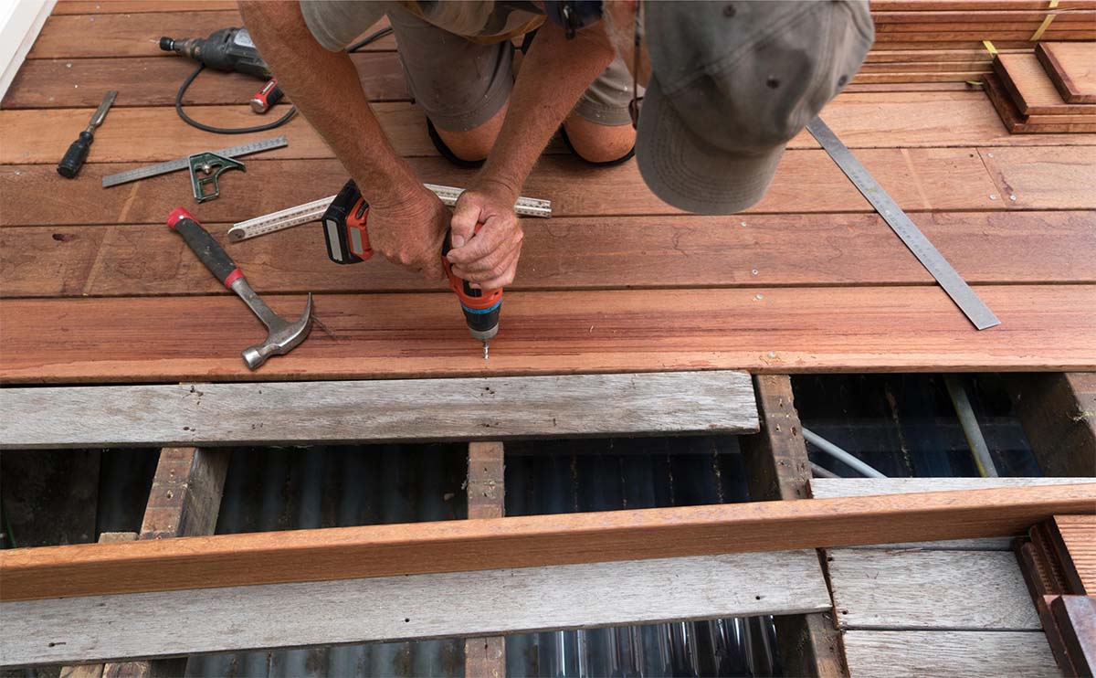 Local Carpenter Installing Decking Boards