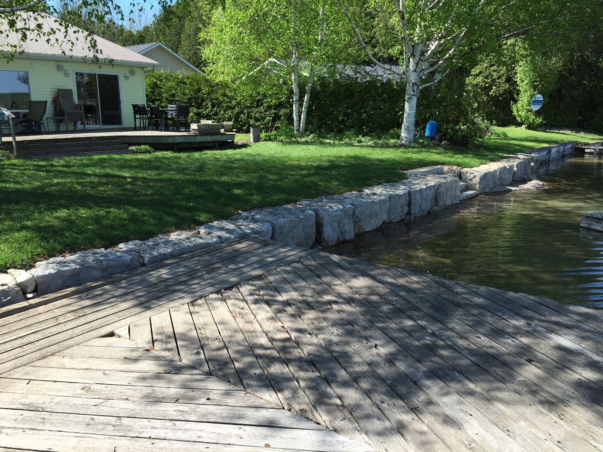 front door stairs with retaining wall