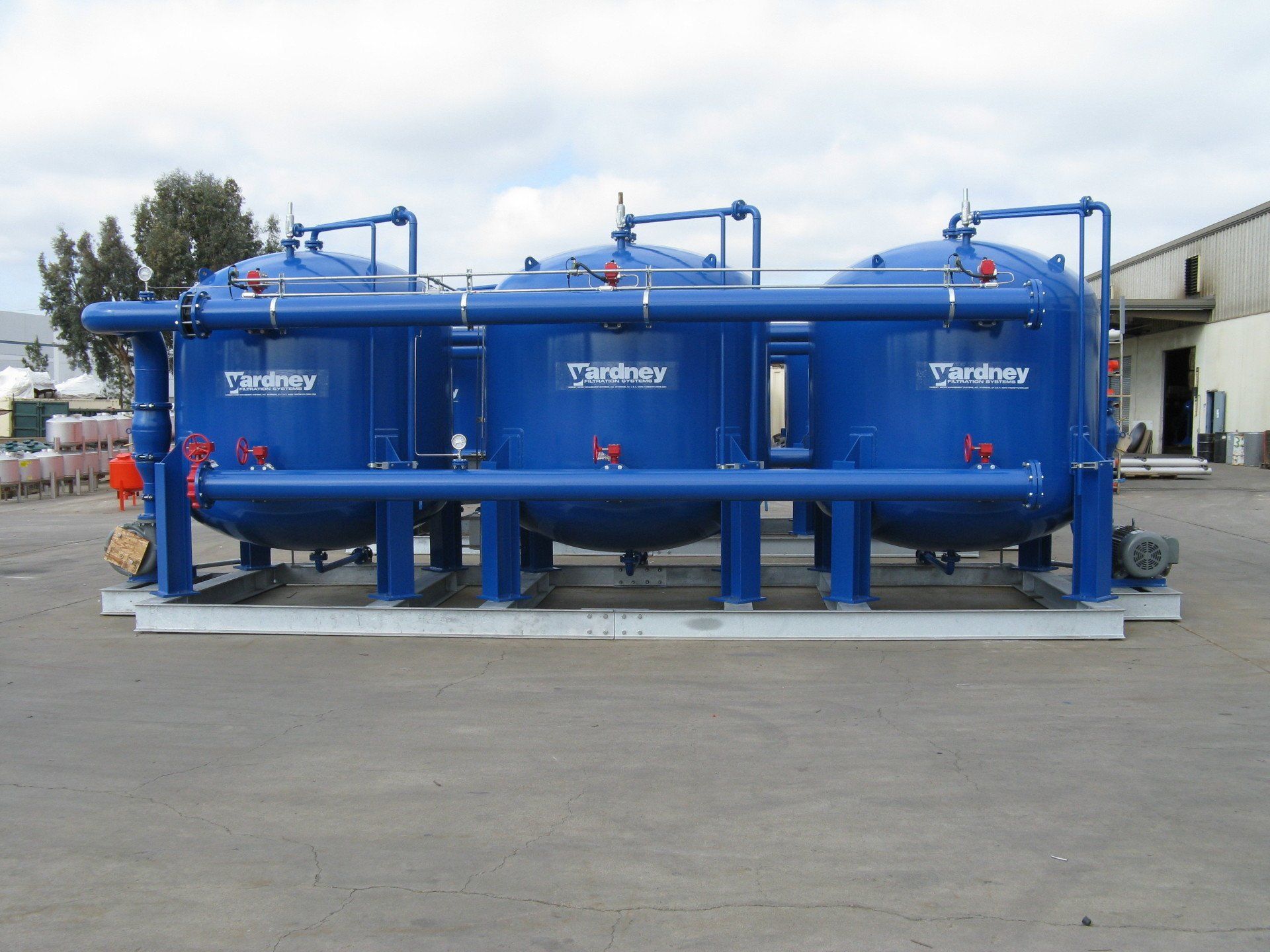A row of blue tanks with the word tanker on them