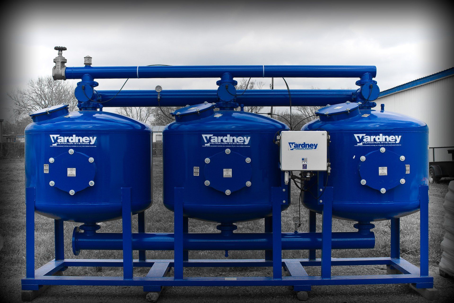 Three blue tanks with the word yardley on them