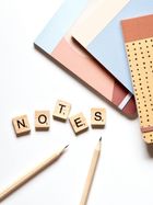 The word notes is spelled out in scrabble tiles