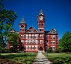 A large red brick building with a clock tower