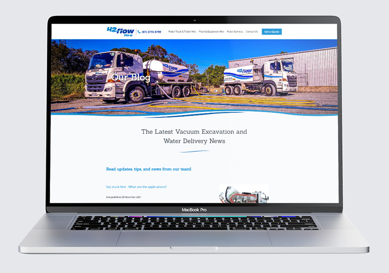a laptop computer is open to a website with trucks on it .