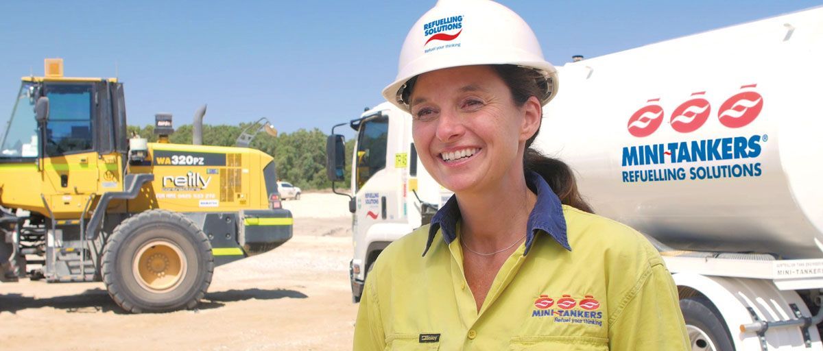 Refuelling Solutions MiniTanker operator wearing a Refuelling Solutions hard hat and MiniTankers shirt.