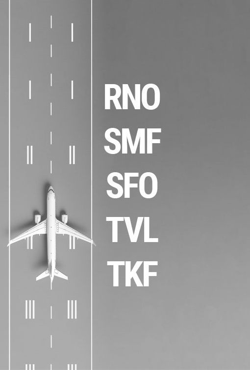 An airplane is taking off from an airport runway with the letters rno smf sfo tvl tkf