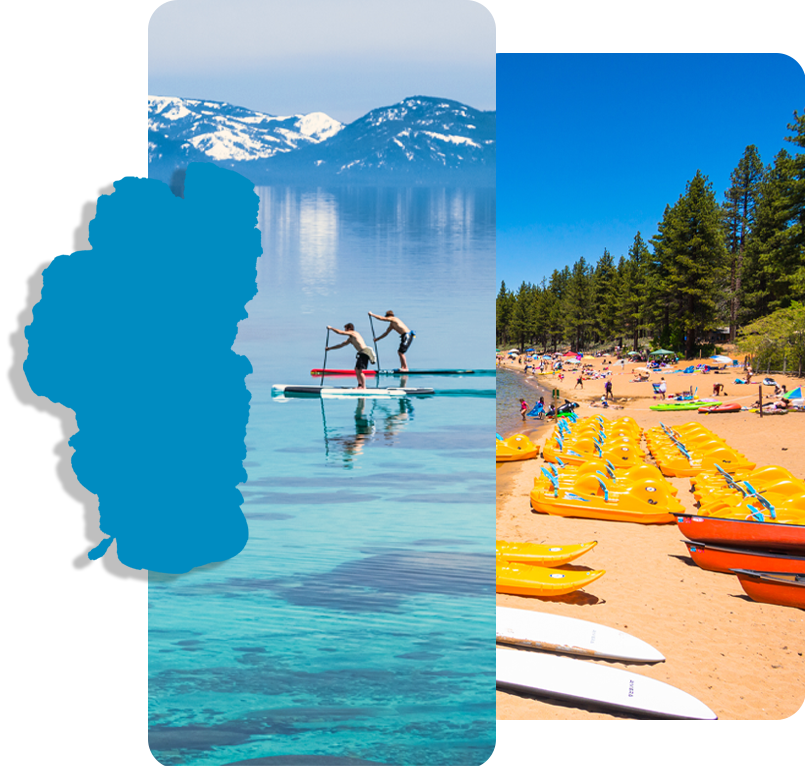 Two people on a paddle board next to a beach with kayaks
