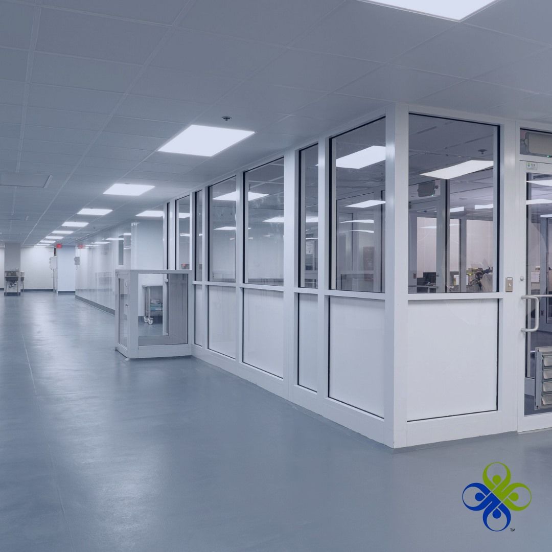 A long hallway in a building with lots of windows