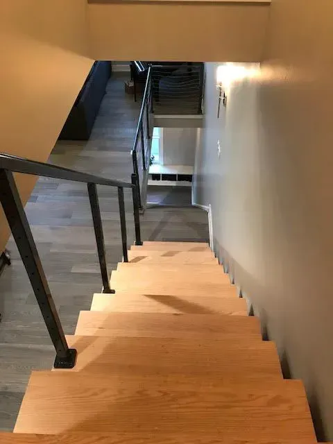 A wooden staircase leading up to a second floor in a house.