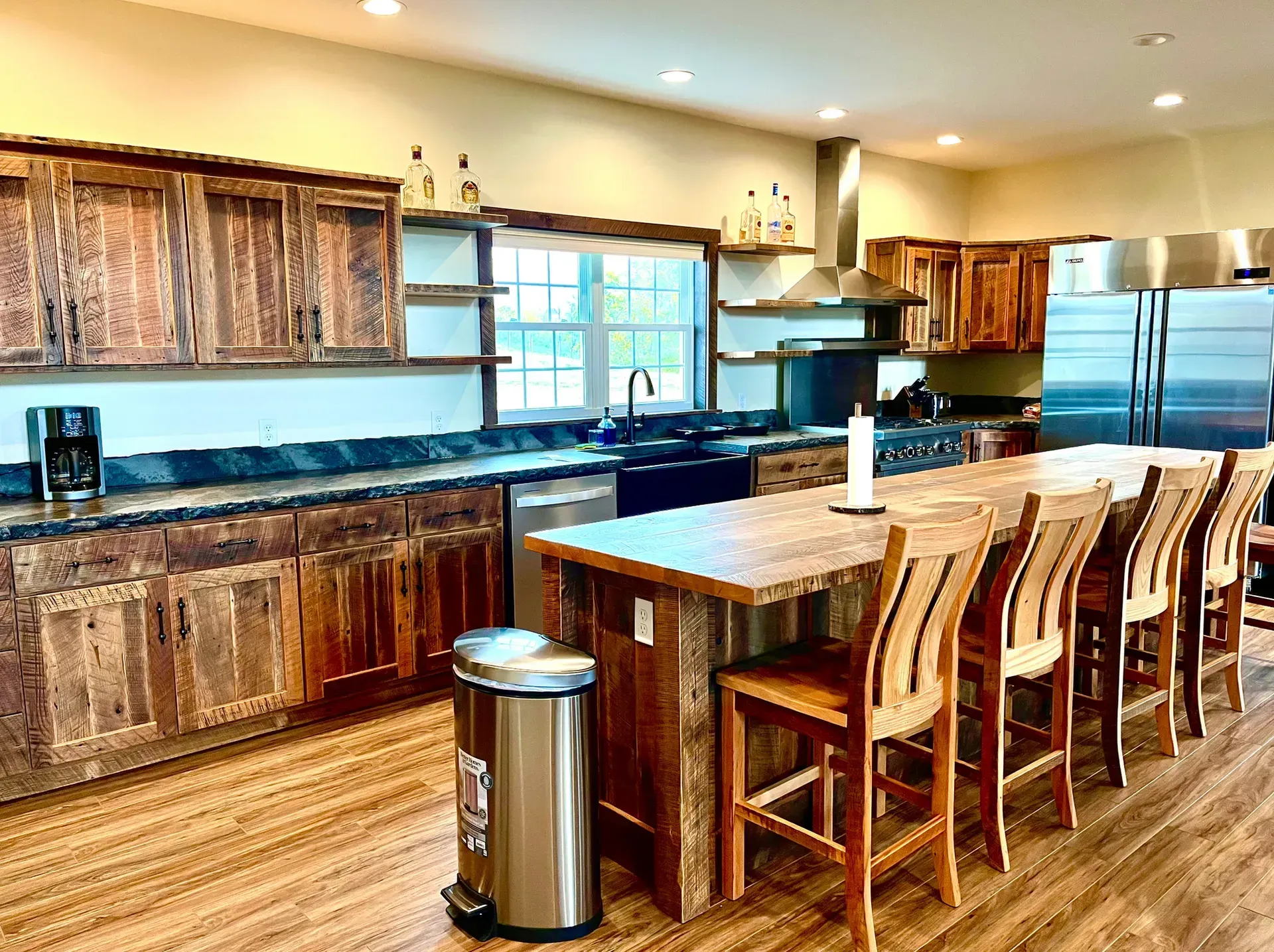 A large kitchen with wooden cabinets and stainless steel appliances.