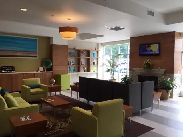 A living room filled with furniture and a television