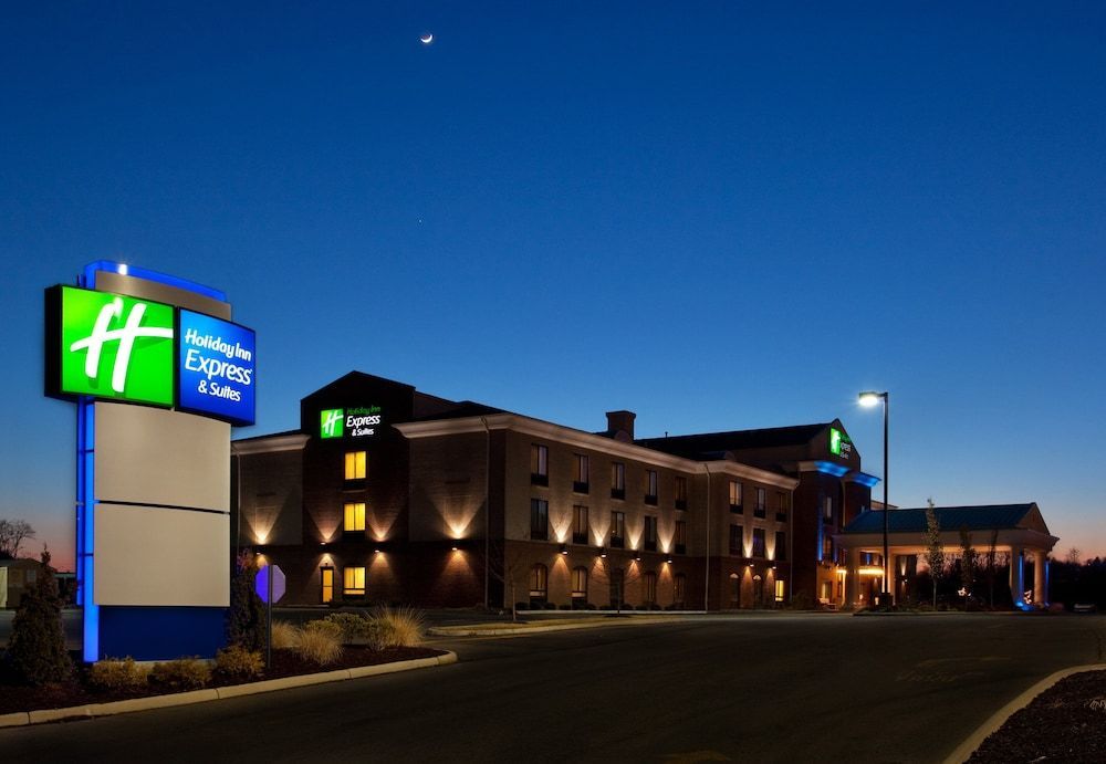 A holiday inn express hotel is lit up at night