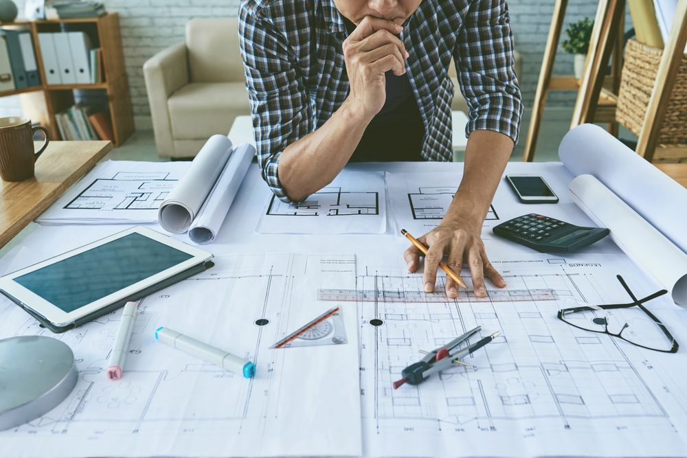 Architect working with construction plans.