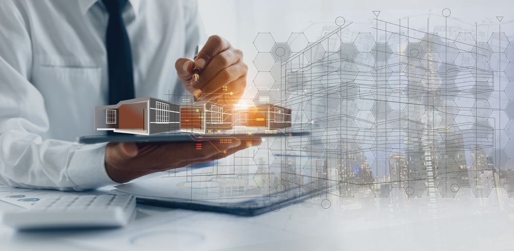 A man is holding a tablet with a model of a building on it.