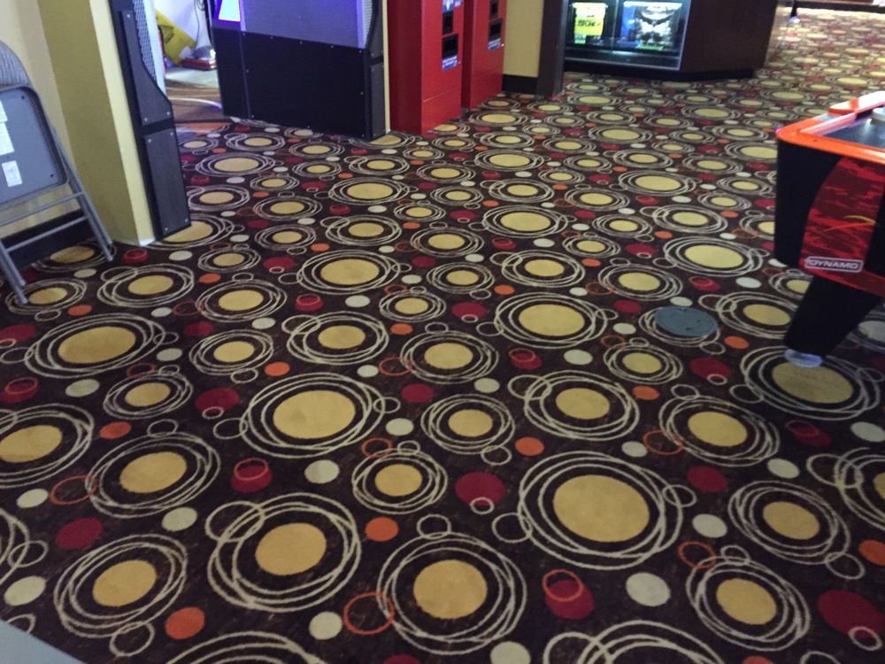 A colorful carpet with circles and dots on it