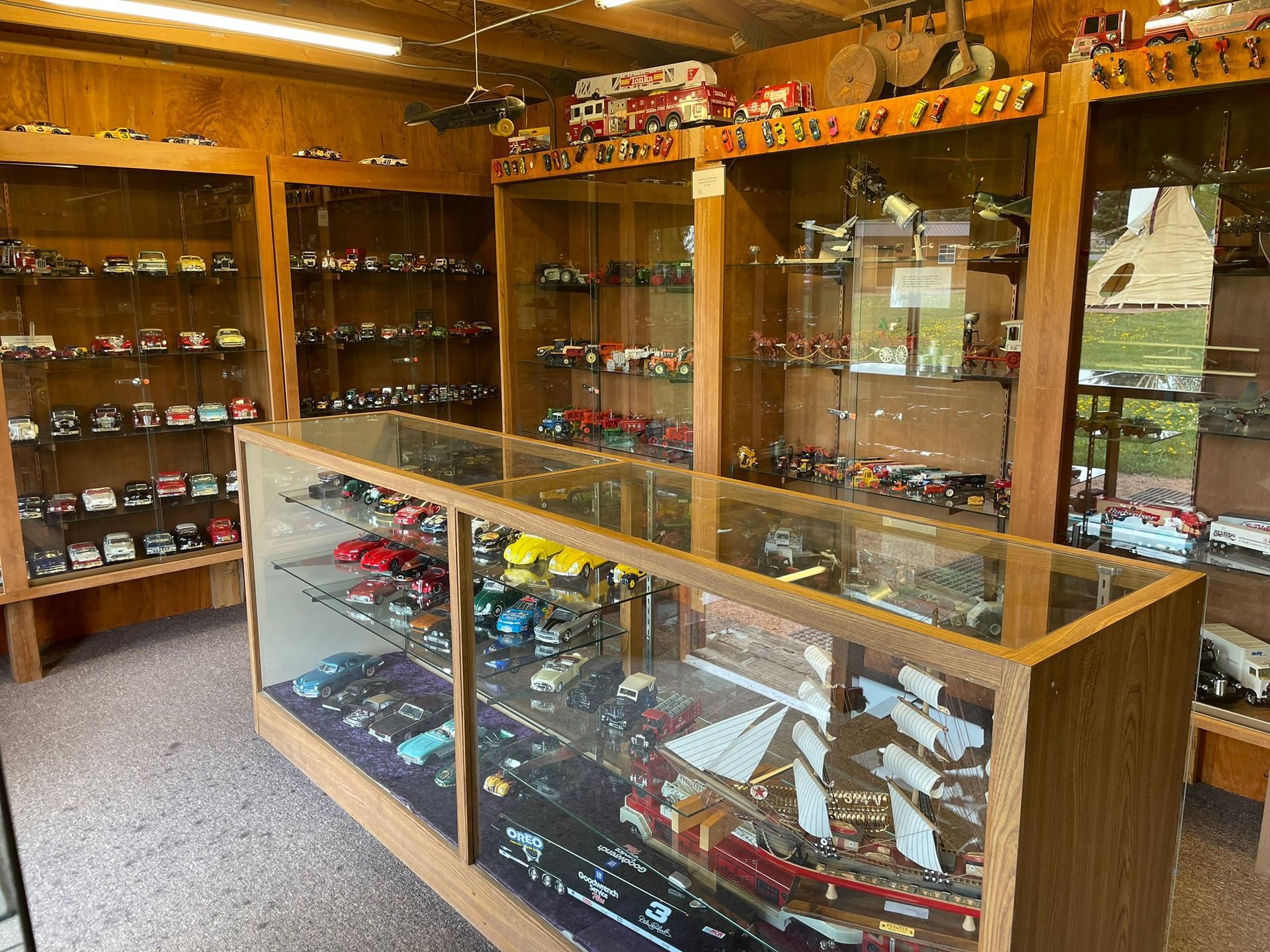 A store filled with lots of toy cars and boats.