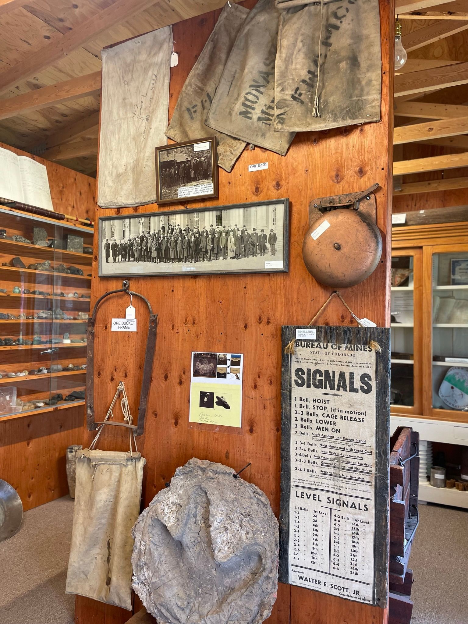 A wooden wall with a sign that says signals on it.