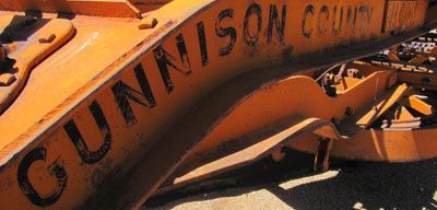 A close up of a gunnison county tractor