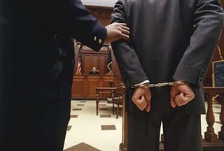 Man Handcuffed — Criminal attorney in Portland, ME
