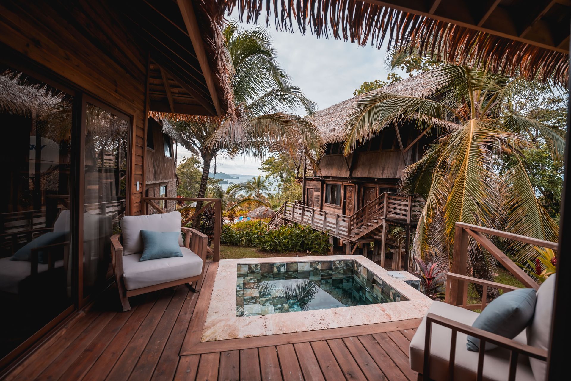A large house with a swimming pool in front of it