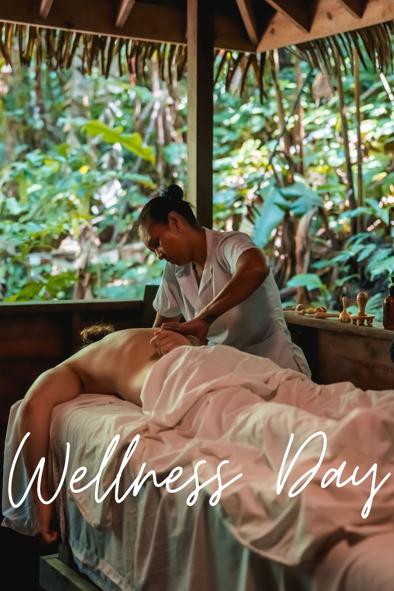 A woman is giving a man a massage in a spa.