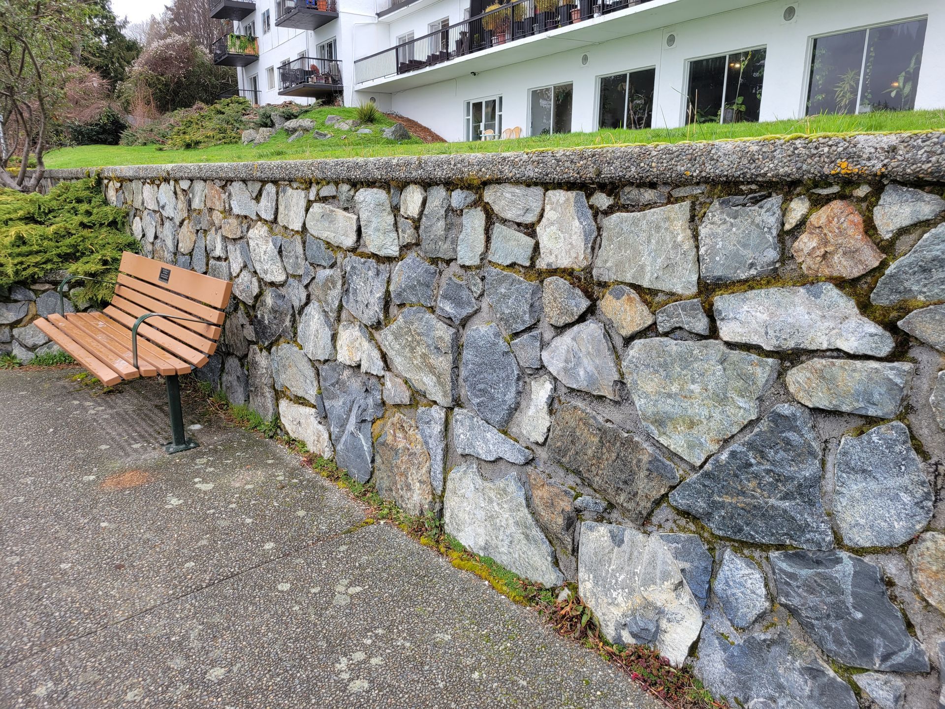 4 ft stone retaining wall on a walkway