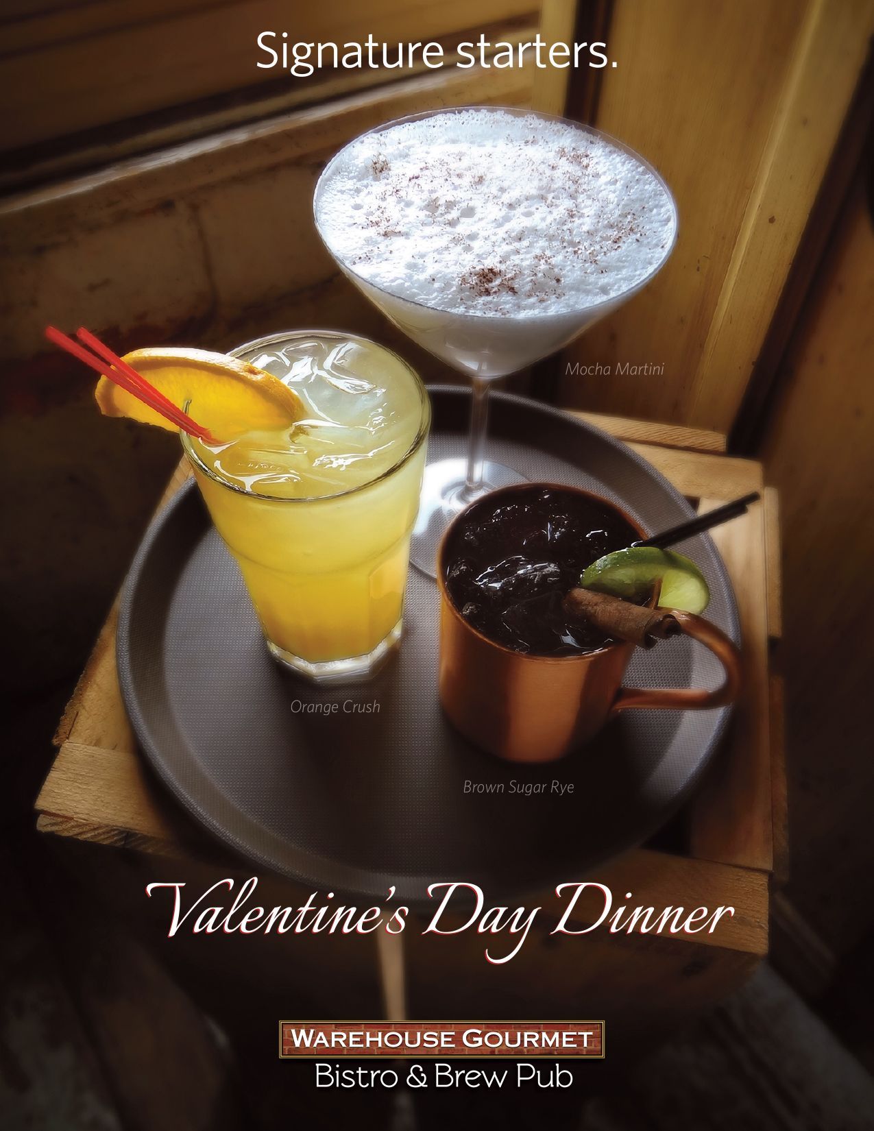 Three cocktails on a dark tray, promoting a Warehouse Gourmet Valentine's Day dinner.
