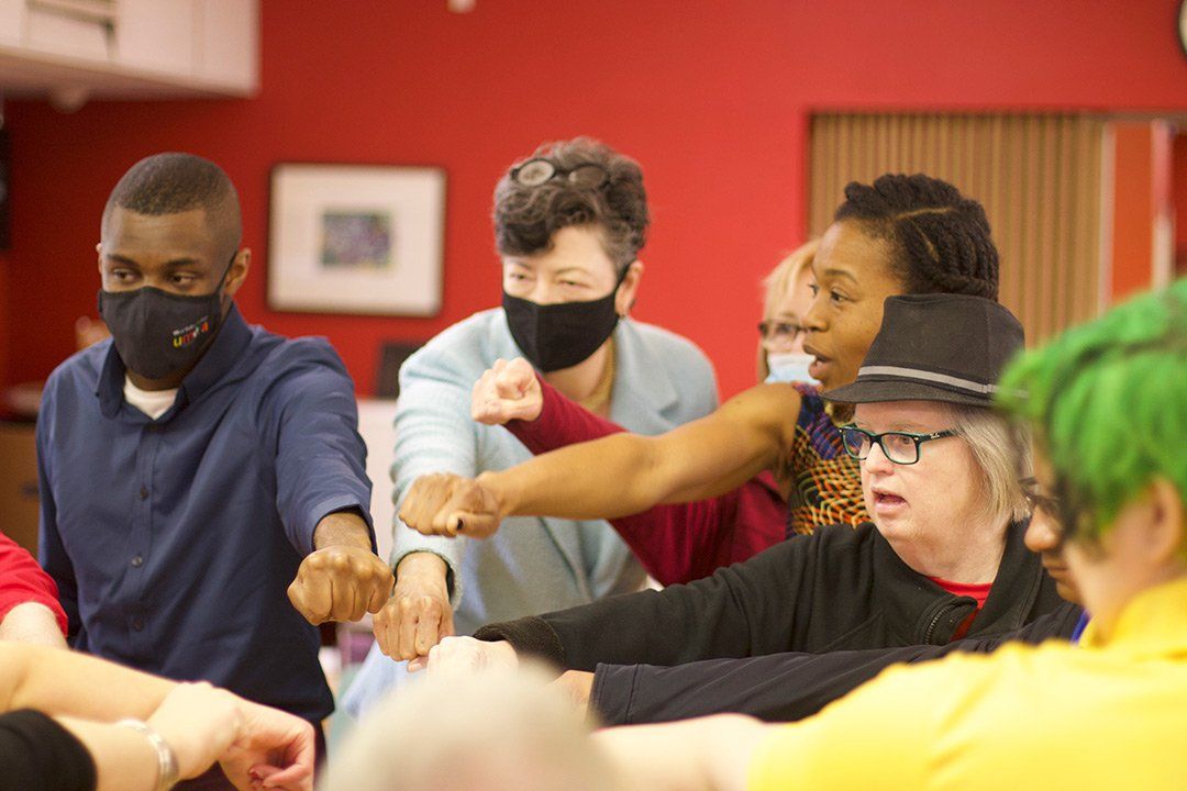 CAA students finishing up a class with the CAA huddle