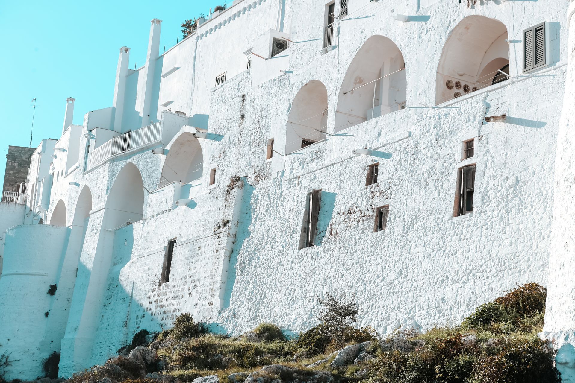 A aerial view of Ostuni showing the picturesque white-washed buildings and winding cobblestone