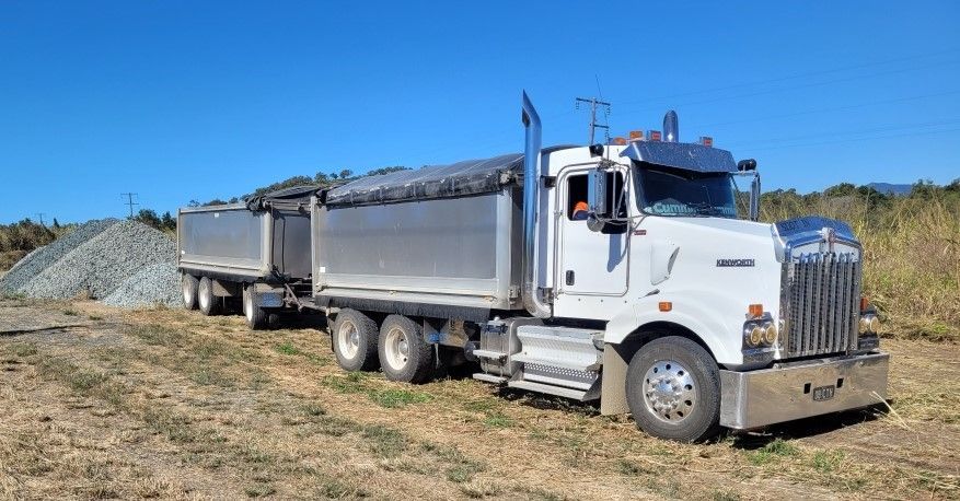 Truck is Carrying a Large Wooden Box — Chewies Tipper Hire & Haulage in Gracemere, QLD
