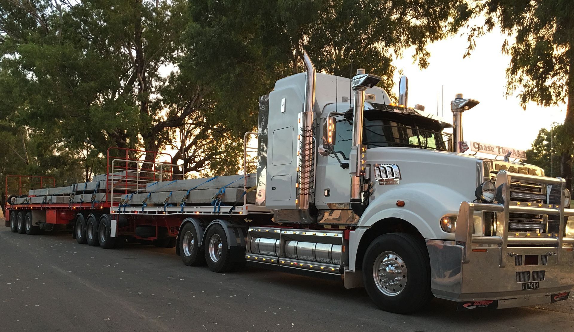 Bulldozer is Being Transported on a Trailer — Chewies Tipper Hire & Haulage in Gracemere, QLD