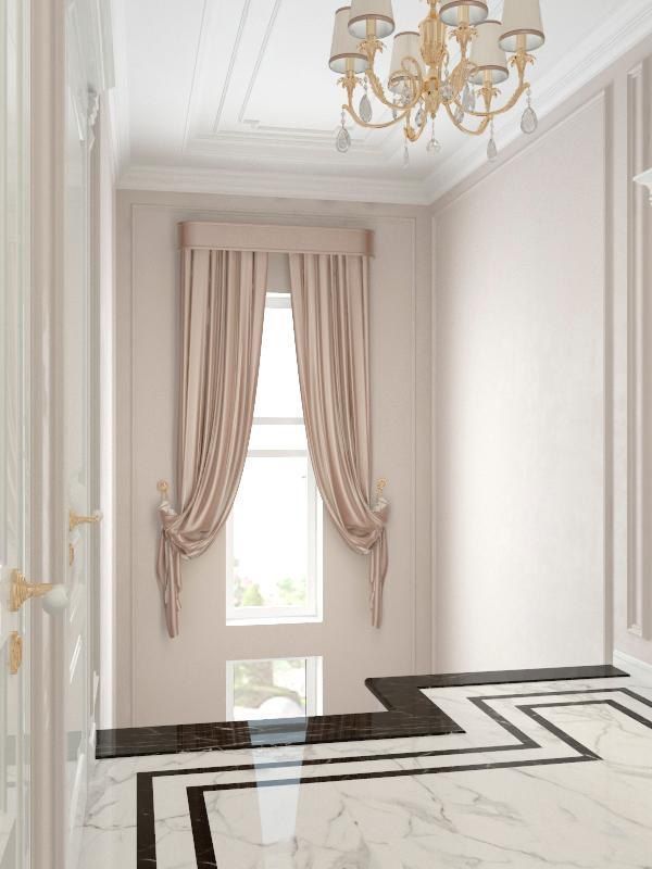 There is a chandelier hanging from the ceiling in the hallway.