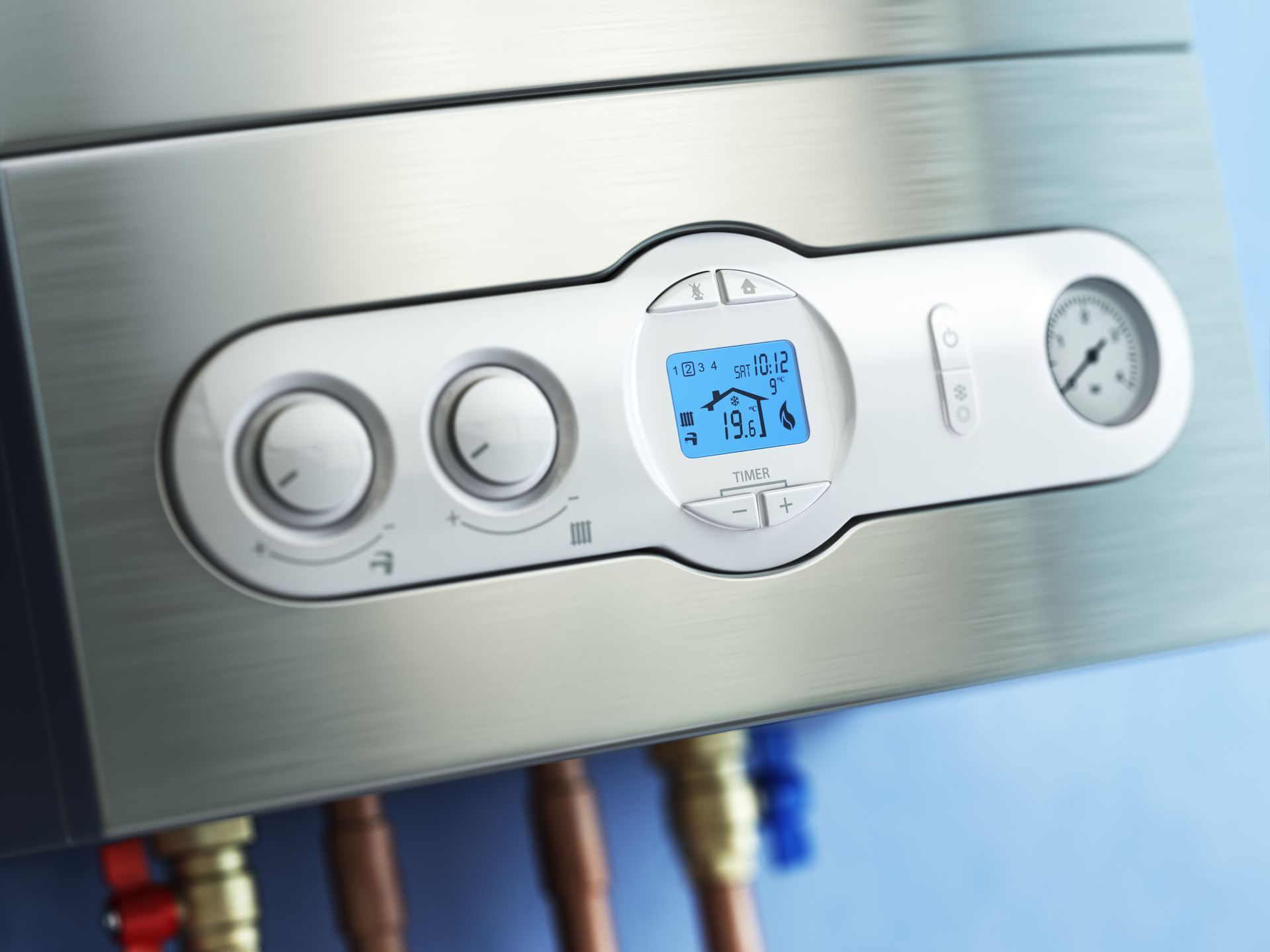 A close up of a boiler with a clock on it