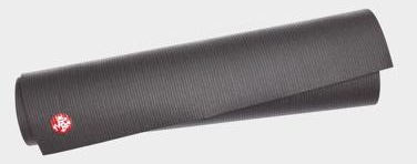 a black yoga mat is rolled up on a white background .
