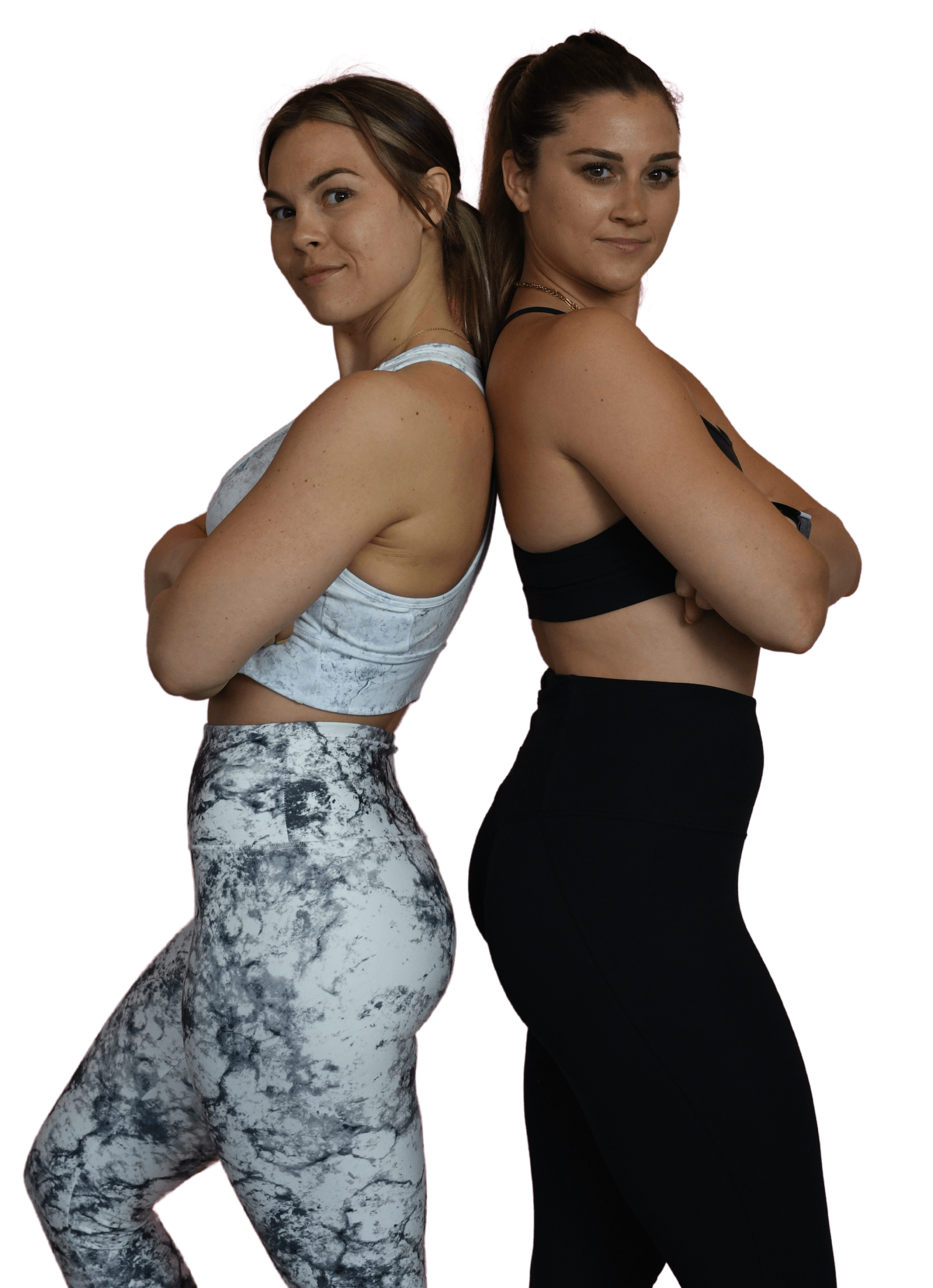 Alexa and Meg, two of the top yoga and pilates teachers on long island standing back to back with their arms crossed