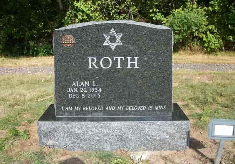 Black granite headstone with a Star of David, the name 