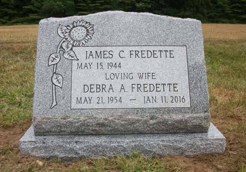Gravestone with names James and Debra Fredette, dates of birth and death, with a sunflower carving.