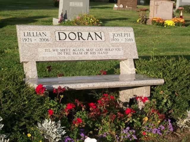 Granite bench tombstone with names 