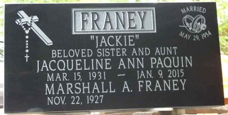 Black granite headstone of Jacqueline Ann Paquin Franey with dates and details.