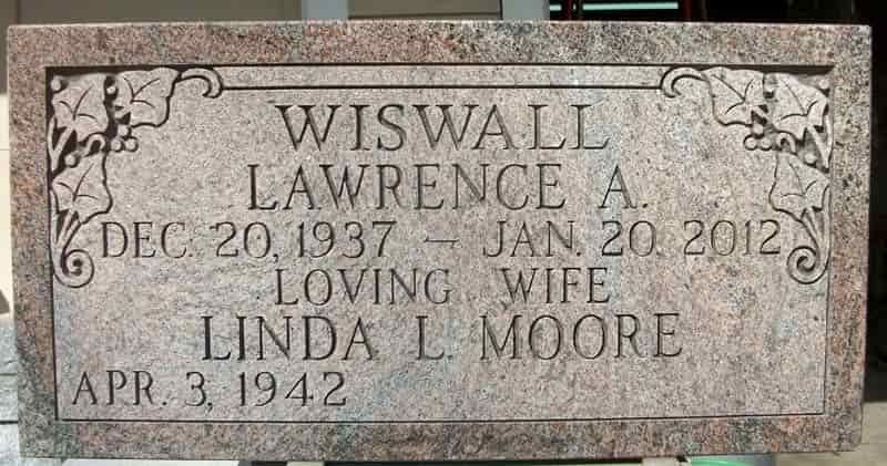 Headstone with the name WISWALL, dates of birth and death for Lawrence A. and Linda L. Moore.