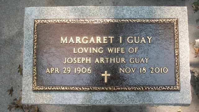 Bronze tombstone with text: 