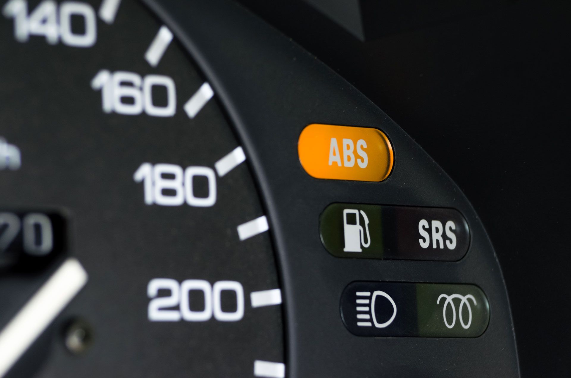 Dashboard with illuminated orange ABS light, other icons visible.