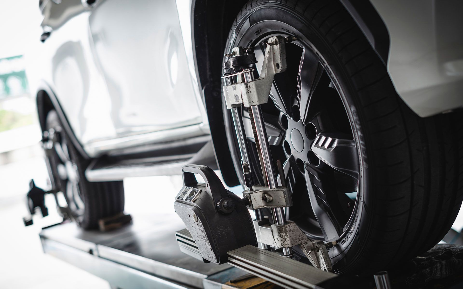 A bulldozer is plowing a field with mountains in the background.