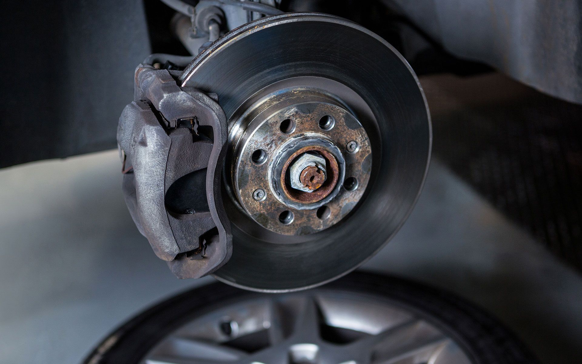 A bulldozer is moving dirt on a dirt road.