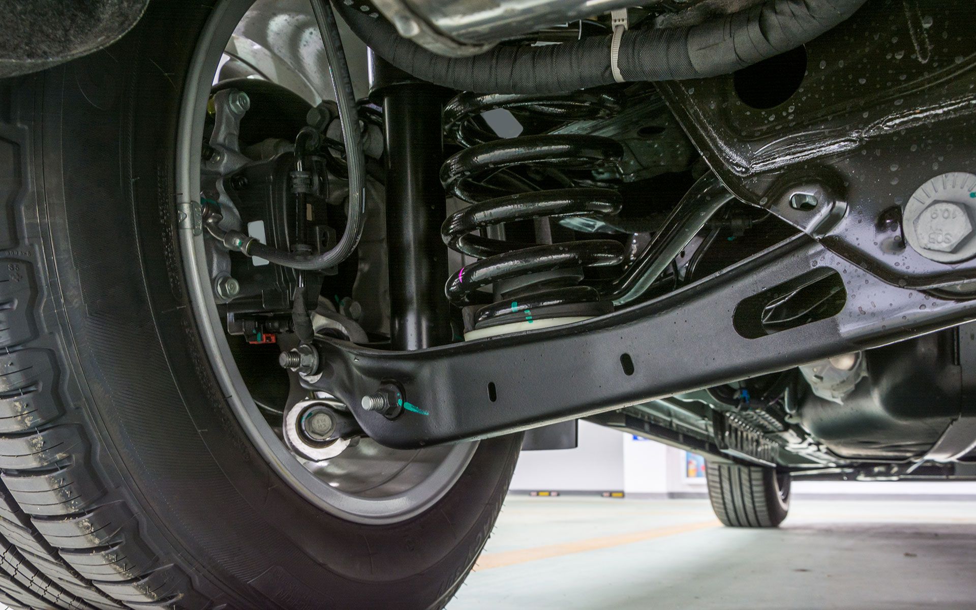 A yellow excavator is digging a hole for a pipe.