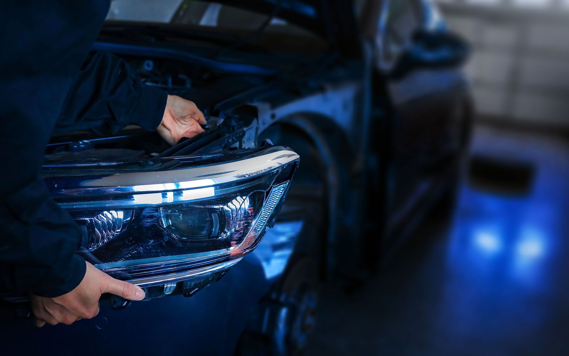 A bulldozer is plowing a field with mountains in the background.