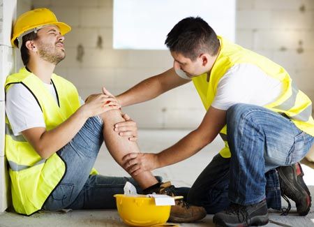 Accident Lawyer — Man Checking its Coworker Leg in Mclean, VA