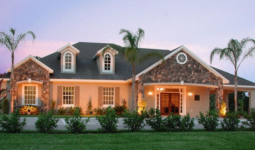 A large house with palm trees in front of it