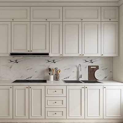 A kitchen with white cabinets , a sink , a stove , and a cutting board. A kitchen with white cabinets , a sink , a stove , and a cutting board.